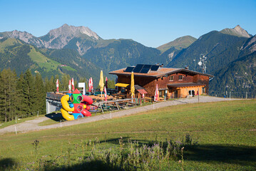 alpine hut with playground at Zwolferkopf mountain, tourist resort Pertisau, tyrol