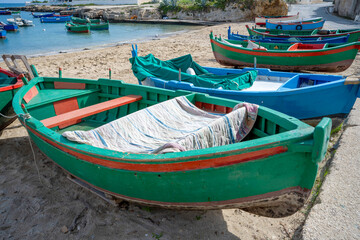 Obraz premium Fishing boats in a bay in Polignano, Italy