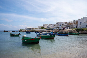 Fototapeta premium Fishing boats in a bay in Polignano, Italy