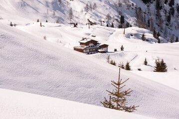 Winter mountain landscape with snow on sunny day in Dolomite alps, Italy