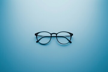 Black eyeglasses placed centrally against a smooth light blue backdrop, highlighting their classic design and unique features. Generative AI