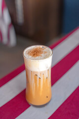 Iced Cappuccino in a Tall Glass on a Table - Refreshing Coffee Beverage for a Hot Day
