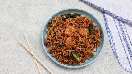 Mie Goreng Udang or Bakmi Goreng Sea Food or Fried Noodle with Sea Food. Indonesian food and...