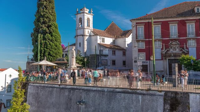 Sculpture of Sao Vicente timelapse hyperlapse (St. Vincent of Saragossa), Lisbon's Patron Saint at Largo De Santa Luzia with church, Alfama District. Miradouro das Portas do Sol. Lisbon, Portugal.