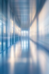 A serene corridor with a sleek design, featuring glass walls that reflect soft light, creating a tranquil, modern atmosphere.