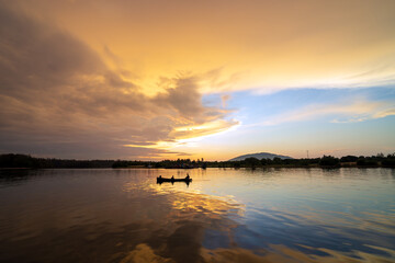 Fishermen are fishing in the river in the morning time.