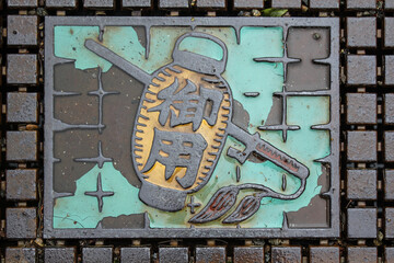 Artistic Manhole Cover Featuring Japanese Lantern Design