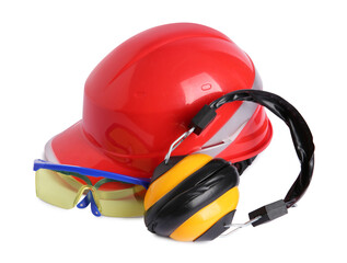 Orange hard hat, earmuffs and goggles isolated on white. Safety equipment