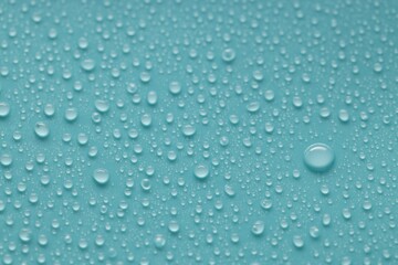 Water drops on turquoise background, above view