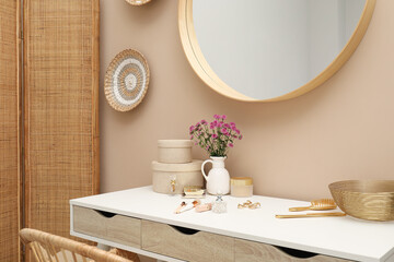 Stylish dressing table with mirror in room