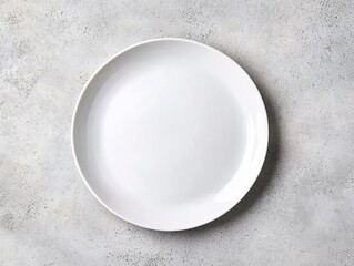 Top-view of a white ceramic plate on a light concrete surface, creating a clean, industrial look for product presentations