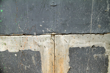 the wall is damaged with spots due to water seepage, the paint is peeling off