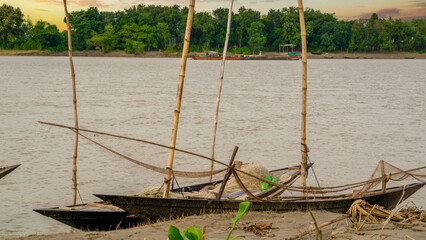 Fototapeta premium Rivers of Asia Fisherman's Hilsa fishing boat. Rural scenery along the river banks of Bangladesh.