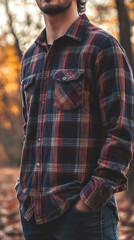 Fototapeta premium Close-up of red and black plaid flannel shirt with buttons.