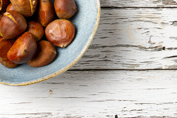 chestnuts on a wooden background
