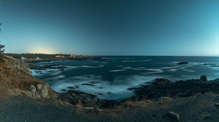 Fototapeta premium Serene Coastal Landscape at Sunset on a Rocky Shoreline