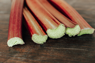 fresh picked Rhubarb stems on the wooden table