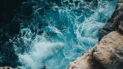 Fototapeta premium A Clifftop View of Foamy Ocean Waves