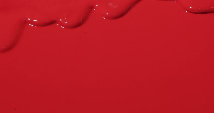 flowing red paint cascades across red background, creating a brilliant wave of texture full with emotions