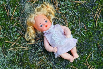 one small old beautiful toy plastic dirty children's pink dress blonde hair lost doll girl with...