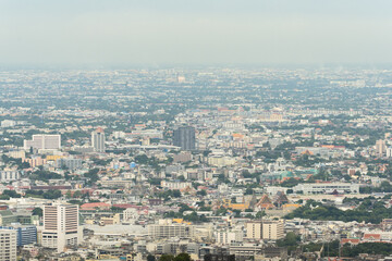 Obraz premium Beautiful modern high building and mountain background.Business and apartment tower in big country.City square and skyline with modern buildings scenery. Cityscape concept at Bangkok Thailand.