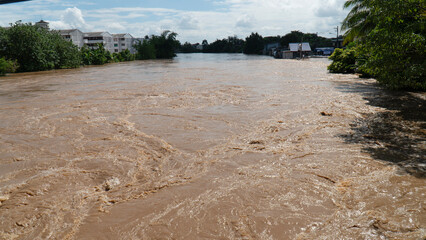 Flooded river landscape, natural disaster scene