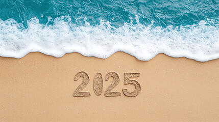 Fototapeta premium Photo of the number 2025 written in sand on a tropical beach with the ocean waves approaching