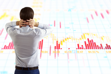 Man looking at stock market charts, white background, financial concept