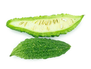slices of bitter gourd arranged on white background