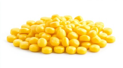 A pile of yellow, round candies isolated on a white background.