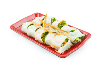 spring rolls with vegetables and fish on a plate