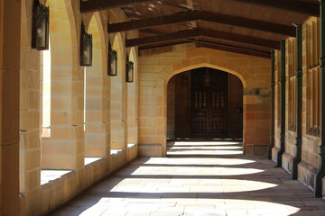 The cloister of Quadrangle  sandstone building. Outdoor corridor or walkway