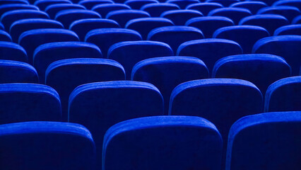 Fototapeta premium Blue empty seats in the audience prepared for the participants of the conference or presentation