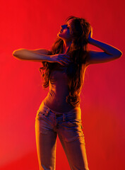Young girl in red light, play of light and shadow