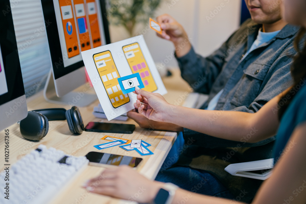 Poster two designers are working together to create the best user experience for a mobile application, choo