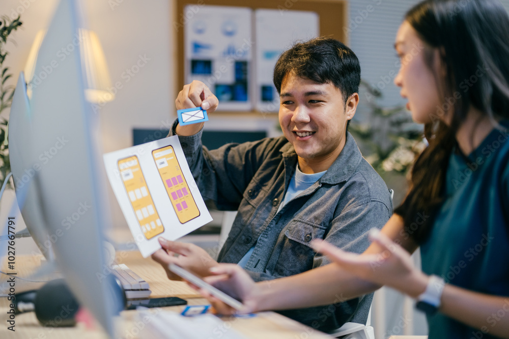 Poster asian ui/ux designers discussing mobile app design in modern office, brainstorming, planning, and co