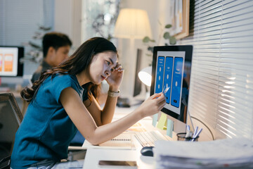 Young female ui/ux designer is feeling stressed and having a hard time finding a solution for her...