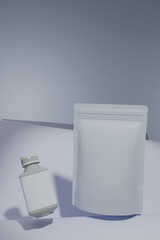 A bottle and a bag are both positioned right next to one another on a table, 3d render