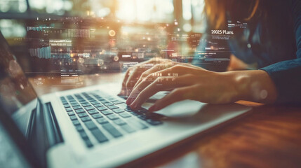 In a contemporary workspace, a person types on a laptop, surrounded by digital overlays depicting data and future plans