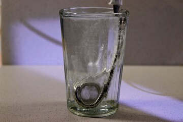 Spiral heater in a glass of boiling water.