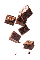 chocolate brownies in cubes falling floating or flying on transparent background. sweet and delicious brownies 