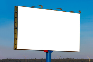 white billboard along the highway on a winter snow day. Background for design and advertising. 