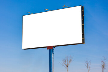 white billboard along the highway on a winter snow day. Background for design and advertising. 