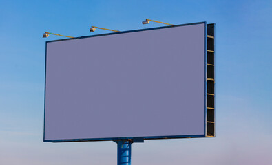 billboard along the highway on a winter snow day. Background for design and advertising. 