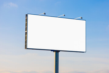 Advertising billboard along the road in the city on a winter day. Background for design. 