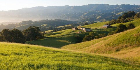 Obraz premium Rolling green hills dotted with farmhouses bask under a clear sky, evoking a sense of tranquility, prosperity, and the harmonious beauty of rural landscapes.