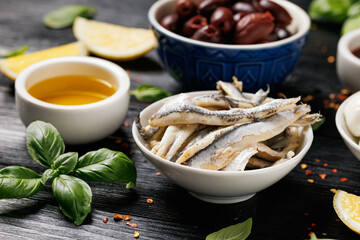 Assortment of marinated anchovies, olives and mini mozzarella cheese. Healthy snacks