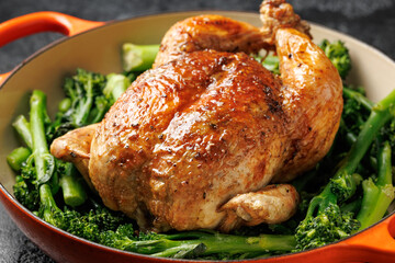 Roasted whole chicken with tenderstem broccoli peas and beans. Low carb food concept