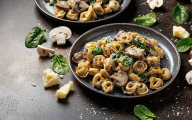 Chestnut Mushrooms and spinach tortellini served with parmesan cheese