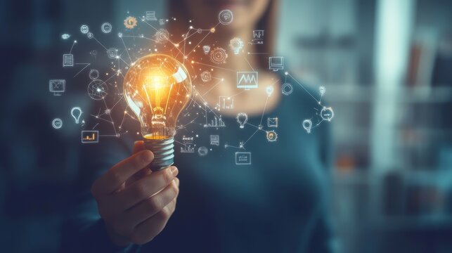 E-learning education concept. Personal development, learning online with webinar, video tutorial, internet lessons. Person holding light bulb with education icon on virtual screen. 